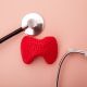 Thyroid gland in red next to stethoscope