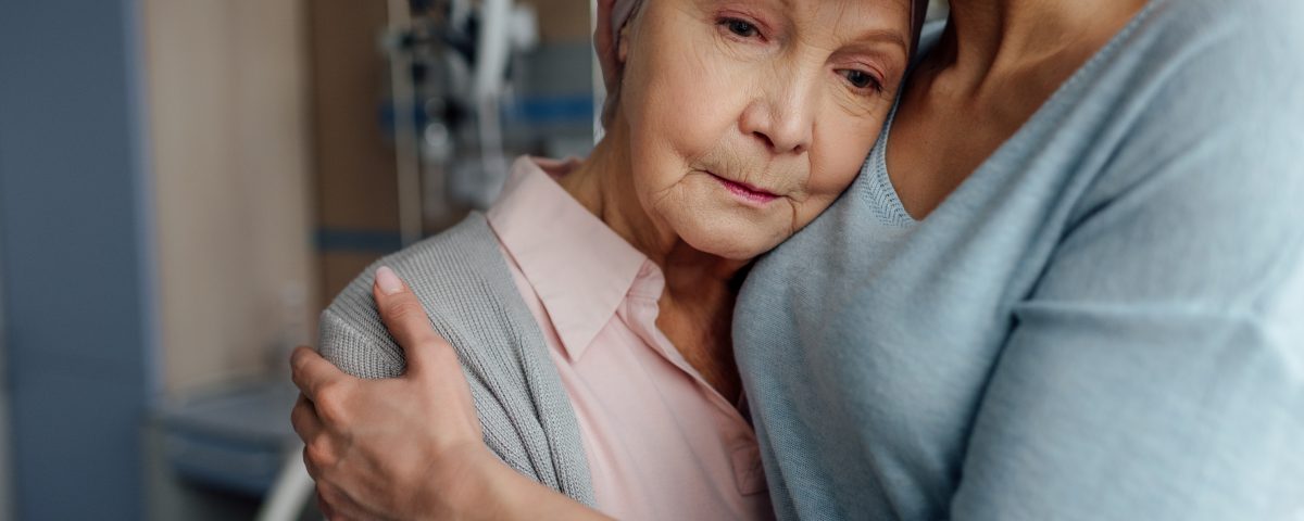 Daughter expresses her love for her mom who is fighting cancer by hugging her in the hospital